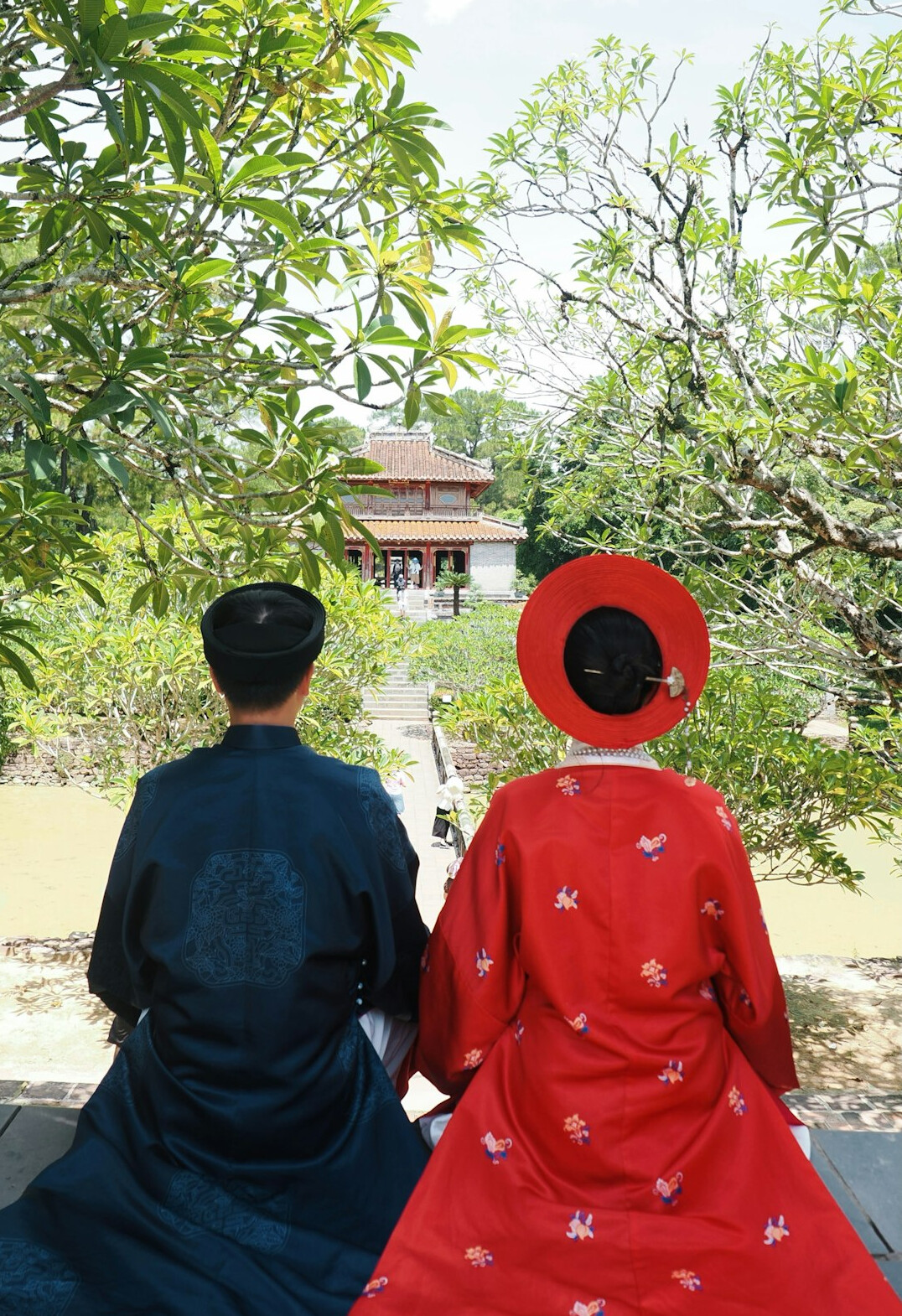 Japanese seniors visiting a traditional temple garden on a group trip