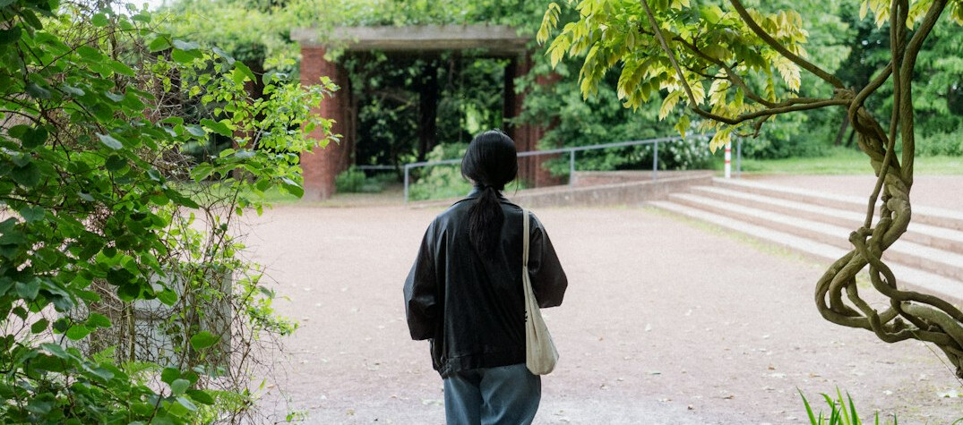 elderly person walking in park
