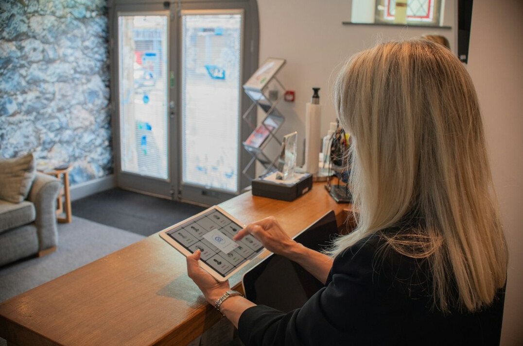 senior reading news on tablet